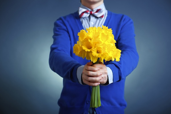 man holding a bouquet of flowers